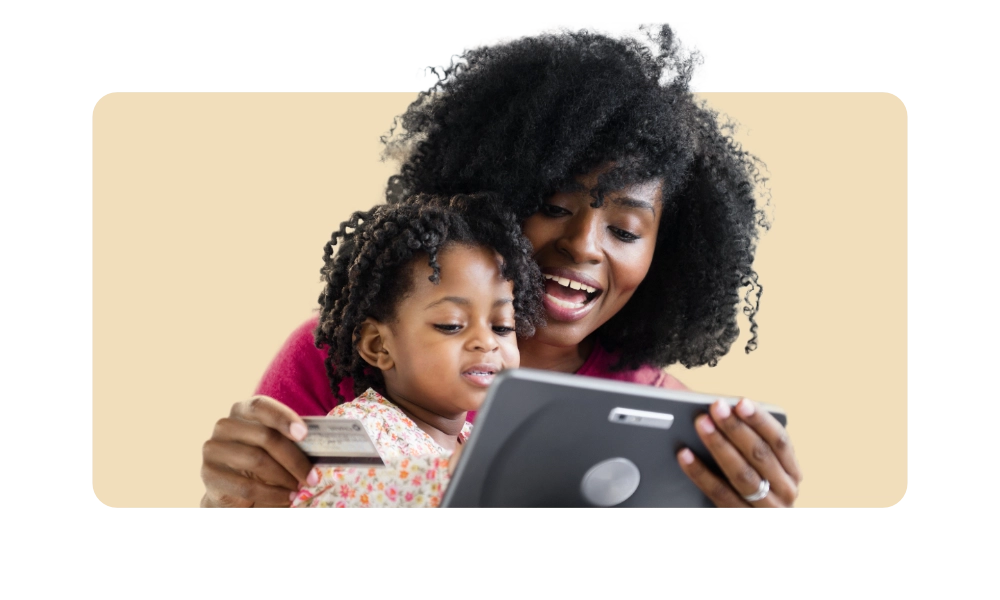 woman with daughter shopping on digital tablet