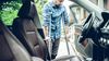 Man on crutches enters his car and is thankful he has Personal Injury Protection.