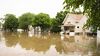 A few houses and a street affected by a flood.