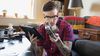 A man is reviewing the appraisal of an antique camera.