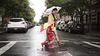 Mother and daughter practice pedestrian safety when crossing the street.