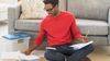Man filing and recording tax information.