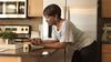 Woman using smartphone to opt in to communications.