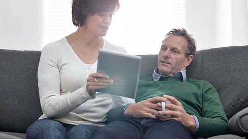 Couple looking at an investment portfolio.