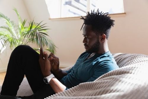 Man searches for an apartment online.