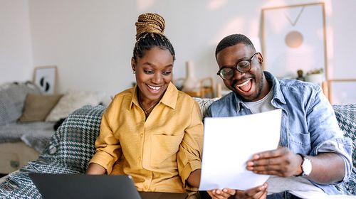 Man and woman reviewing document.